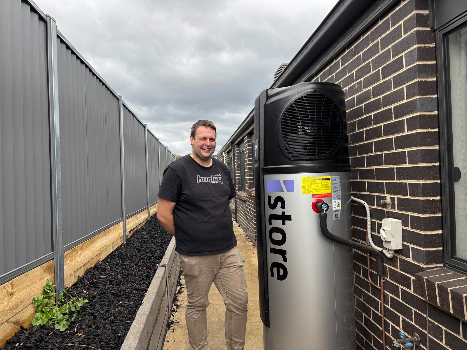 Michael with his heat pump hot water system